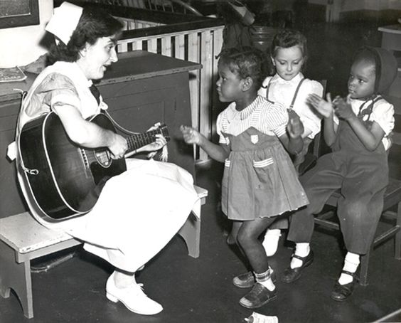 Nurse playing guitar of pediatric patients