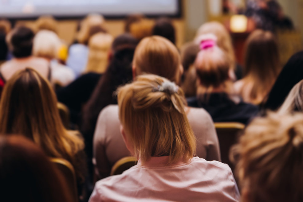 Back of women's head in audience