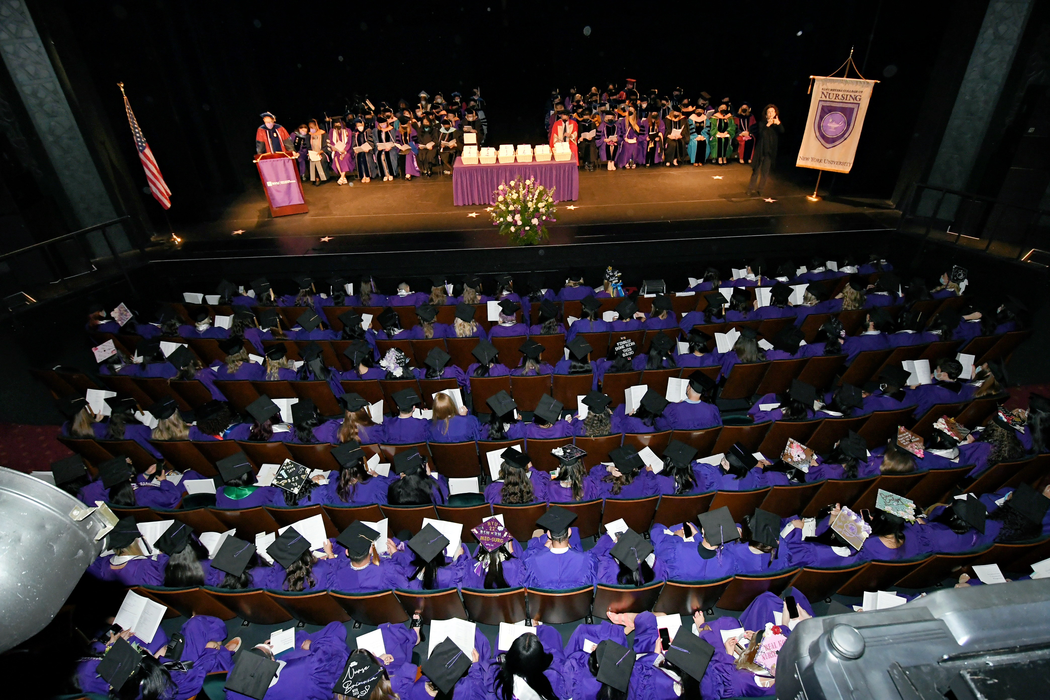 Photo of graduates and faculty on stage at 2022 Meyers Graduation Ceremony