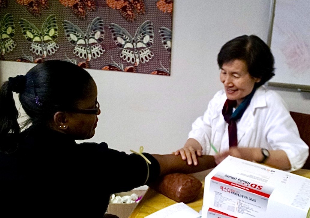 Prof. Haeok Lee with a patient from Malawi