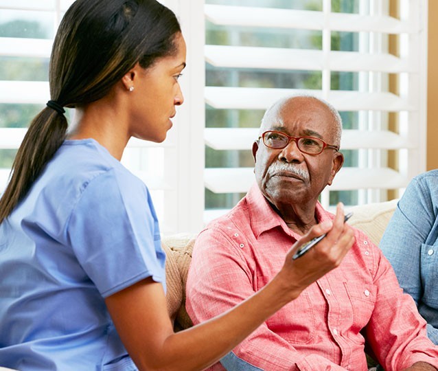 Nursing speaking to patient in consultation