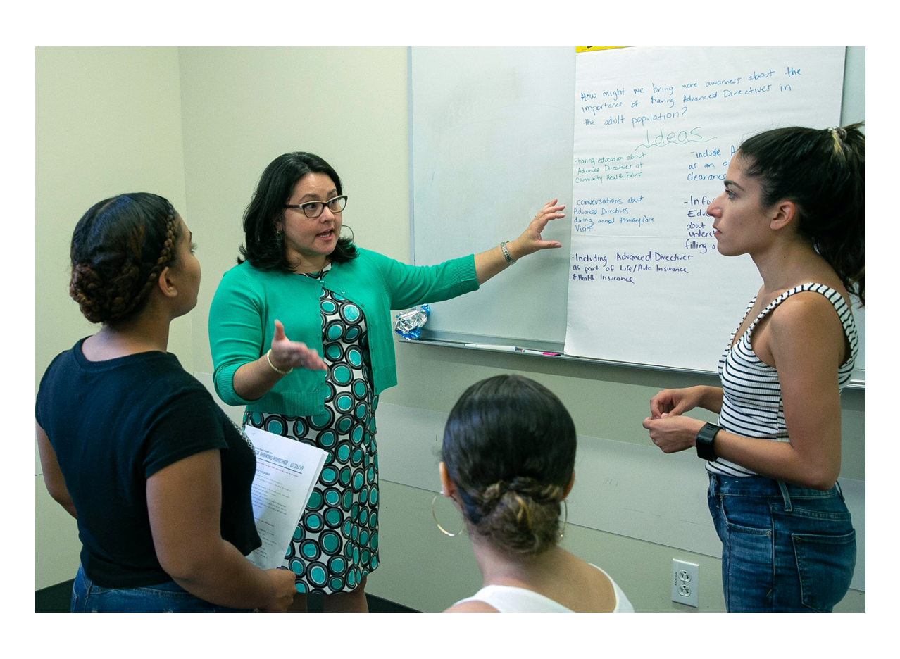 Prof. Crespo-Fiero teaching in the classroom