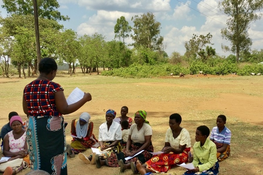 A women talking to a group of people