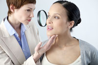 Midwife examining woman's face