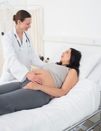 Midwife with pregnant woman