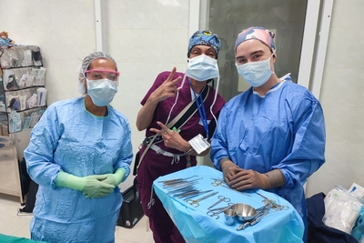 Alex and colleagues in the operating room