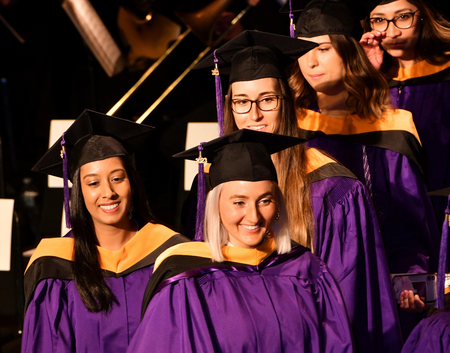 NYU graduates walk across stage
