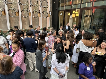 Alumni and staff outside hotel congregating
