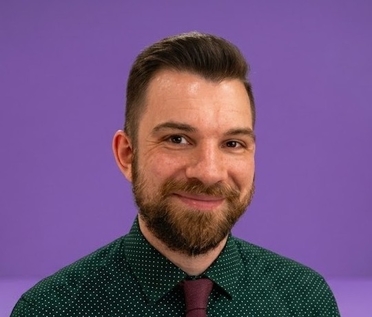headshot of adam poltrack against an nyu purple background