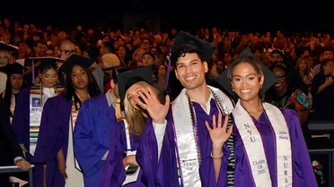 graduates waving 