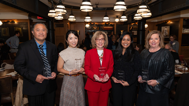 group pic hold their awards 