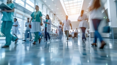 time lapse hallway of a hospital with medical professionals