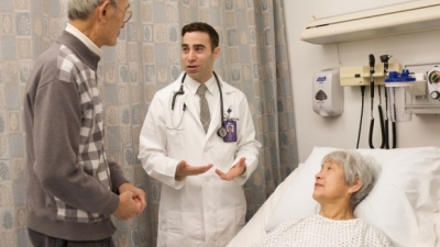 Prof. Ab Brody helping patient