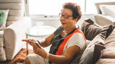 Older adult looks at image on her phone