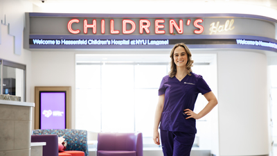 Kristen at Hassenfeld Children's Hospital in nyu purple scrubs