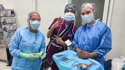 Alex and colleagues in the operating room