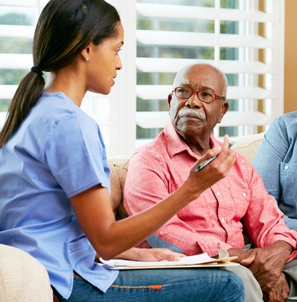 Nurse talking to patient and caregiver